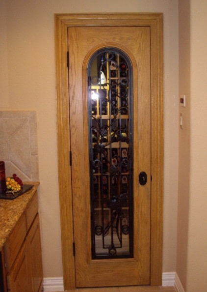 Elegant Door Designed for a Residential Custom Wine Cellar Built in a Small Closet 