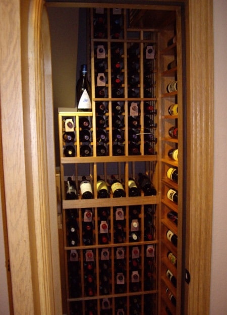 Custom Wine Racks Designed for a Residential Wine Cellar Built in a Closet